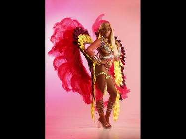 SUNshine Girl Nene is our sun-kissing  caramel-coated Trinidadian girl who will be jumping up at the Toronto Caribbean Carnival this weekend. She will be resplendent pink and yellow feathers and bejewelled outfit called Revolt as part of the  the Atlantic mas camp. Better known as Nene Glamourous - she is a hip hop star who just dropped her single called Money Dance. She loves travelling the hot life in place like Ecuador, Trinidad and Miami wearing basically bikinis and soaking up the sun    Jack Boland/Toronto Sun/Postmedia Network