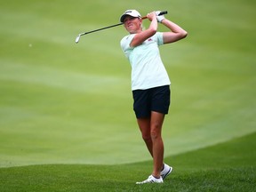 Stacy Lewis hits her second shot on the 15th hole during the second round of the CP Women's Open at Magna Golf Club in Aurora, Ont., on Friday, Aug. 23, 2019.