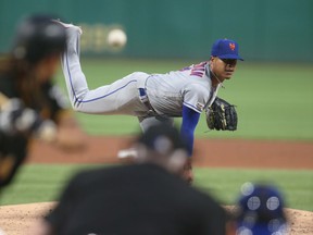 Mets starting pitcher Marcus Stroman delivers against the Pirates during the fourth inning on Saturday night at PNC Park in Pittsburgh. Stroman was making his Mets debut after being traded to New York by the Toronto Blue Jays. He went 4.1 innings, allowing three runs on seven hits while striking out three and walking two. (USA TODAY SPORTS)