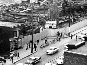 History tells us that there were two reasons for streetcar tracks on Eglinton Ave. between Yonge St. and Mt. Pleasant Rd. The most popular belief is that they were to be used as access to and from the Eglinton Car House (now the site of the TTC's Eglinton station on the Yonge subway) for the ST. CLAIR streetcars operating on Mt Pleasant Rd. These tracks were never used nor were they removed when the subway opened in 1954. We know that because they are still there in this photo I took September 8, 1958, two days after the new Union Carbide building under construction at the Redpath and Eglinton intersection collapsed in a wild windstorm.