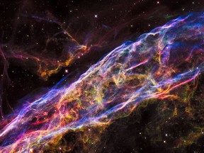 A small section of the Veil Nebula, a massive star that exploded about 8,000 years ago, is seen by NASA's Hubble Space Telescope. The debris is one of the best-known supernova remnants. (NASA)