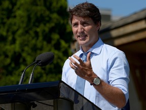 Prime Minister Justin Trudeau speaks about a watchdog's report that he breached ethics rules by trying to influence a corporate legal case, at the Niagara-on-the Lake Community Centre in Niagara-on-the-Lake, Ont., August 14, 2019. REUTERS/Andrej Ivanov/File Photo