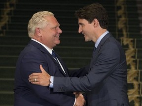 Ontario Premier Doug Ford, left, meets with Prime Minister Justin Trudeau at Queen's Park in Toronto on July 5, 2018.