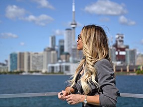 WWE Hall of Famer Trish Stratus looks out over Lake Ontario from Polson Pier at the skyline of her hometown, Toronto, on Saturday, Aug. 10. 2019. (Photo by Joe Hrycych)