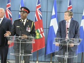 Toronto Police Chief Mark Saunders, with Premier Doug Ford and Toronto Mayor John Tory, announce funding for new closed circuit cameras on Friday August 23, 2019.