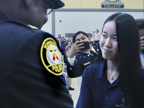153 graduates between the ages of 15-18 were all smiles as they lined up to shake hands with Police Chief Mark Saunders, Mayor John Tory, and other dignitaries after completing this year's Youth In Policing Initiative (YIPI) eight - week summer program on Thursday August 22, 2019