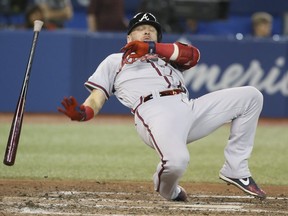 Atlanta Braves third baseman Josh Donaldson is knocked down at the plate in the seventh inning at the Rogers Centre on Tuesday night. Veronica Henri/Toronto Sun/Postmedia Network