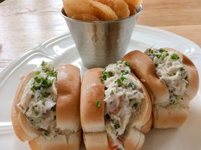 Warm, toasted rolls stuffed with juicy Dungeness crab at Honey Salt in Vancouver’s Parq resort.