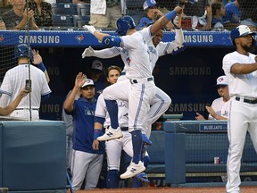 Toronto Blue Jays right fielder Randal Grichuk celebrates with third baseman Vladimir Guerrero Jr. after hitting a home run against Seattle Mariners in the third inning at Rogers Centre on Friday, Aug. 16, 2019.