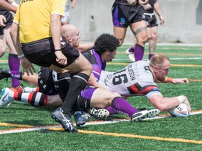 Toronto Wolfpack’s Tom Olbison tries to get past Rochdale during their game yesterday at Lamport. The Wolfpack won 46-0. (Matthew Tsang photo)