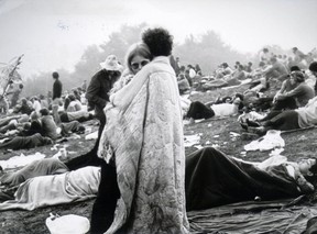 Half a million people gather on a dairy farm in Bethel, N.Y., in 1969 to listen to the likes of Jimi Hendrix and The Who at the Woodstock music festival.