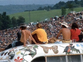 Half a million people gather on a dairy farm in Bethel, N.Y., in 1969 to listen to the likes of Jimi Hendrix and The Who at the Woodstock music festival.