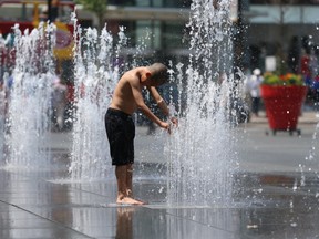 Yonge-Dundas Square is one place to be to beat the heat in Toronto this holiday weekend. (Jack Boland/Toronto Sun/Postmedia Network