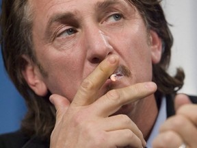 Actor Sean Penn smokes during a news conference in 2006 for All The Kings Men  during TIFF. (David Lucas, Toronto Sun)