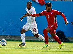 Cuba defender Daniel Morejon (right) tries to cover Canada forward Junior Hoilett during Gold Cup play this summer. (USA TODAY SPORTS)