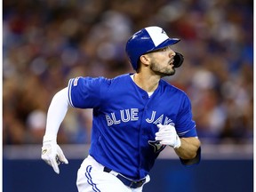 Randall Grichuk #15 of the Toronto Blue Jays watches the ball clear the fence as he hits a home run in the third inning during a MLB game against the New York Yankees at Rogers Centre on September 15, 2019 in Toronto, Canada.