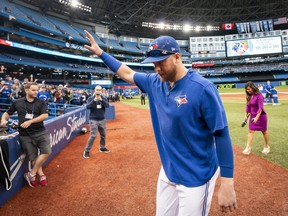 Justin Smoak #14 of the Toronto Blue Jays walks off the field after his team defeated the Tampa Bay Rays in the final game of the season in their MLB game at the Rogers Centre on September 29, 2019 in Toronto, Canada. (Photo by Mark Blinch/Getty Images)