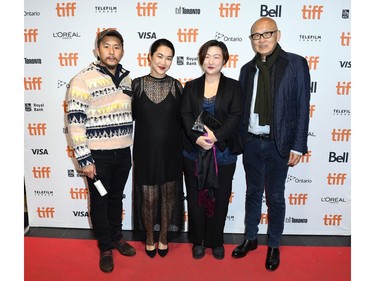 (L-R) Justin Chon, Jackie Chung, guest and Wayne Wang attend the "Coming Home Again" photo call during the 2019 Toronto International Film Festival at TIFF Bell Lightbox on Sept. 7, 2019 in Toronto.