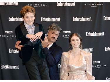 (L-R) Roman Griffin Davis, Taika Waititi and Thomasin McKenzie attend Entertainment Weekly's Must List Party at the Toronto International Film Festival 2019 at the Thompson Hotel on Sept. 7, 2019 in Toronto.