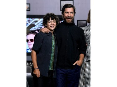 Noah Jupe, left, and Christian Bale attend the "Ford v Ferrari" press conference during the 2019 Toronto International Film Festival at TIFF Bell Lightbox on Sept. 10, 2019 in Toronto.