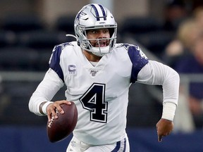 Dak Prescott #4 of the Dallas Cowboys scrambles with the ball against the Miami Dolphins in the second half at AT&T Stadium on September 22, 2019 in Arlington, Texas. (Tom Pennington/Getty Images)