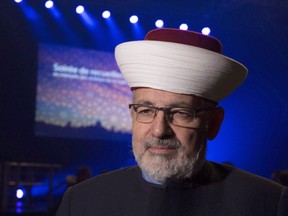 Imam Hassan Guillet arrives at a gathering at the Pavillon de la Jeunesse, marking the first anniversary of a mosque shooting on Jan. 28, 2018 in Quebec City. (The Canadian Press)