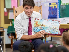 Prime Minister Justin Trudeau reads a story to Grades 1 and 2 students during a campaign stop at Blessed Sacrament Catholic Elementary School in London, Ont.,  on Sept. 16, 2019. (AFP/Getty Images)