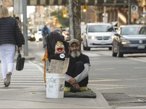 Blair and his puppet at the corner of Queen and Bay Sts. on Sept. 19, 2019. (Jack Boland, Toronto Sun)