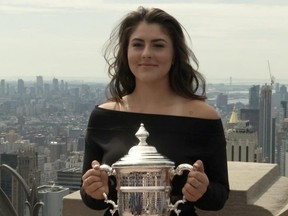 U.S. Open winner Bianca Andreescu poses with her trophy in New York on Sept. 8, 2019. (REUTERS)