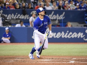 Blue Jays centre fielder Randal Grichuk  watches his ball leave the Rogers Centre on Sunday against the New York Yankees. Grichuk leads Toronto with 28 home runs this season. (Nick Turchiaro/USA TODAY Sports)