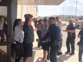 People are evacuated from Cinergy Odessa cinema following a shooting in Odessa, Texas, U.S. in this still image taken from a social media video August 31, 2019. (Rick Lobo via REUTERS)