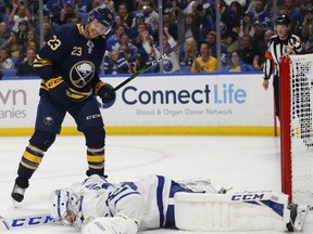 Buffalo Sabres forward Sam Reinhart (23) watches the puck go past Toronto Maple Leafs goalie Michal Neuvirth (35) during the second period of an NHL preseason hockey game Saturday, Sept. 21, 2019, in Buffalo, N.Y.  THE CANADIAN PRESS/AP-Jeffrey T. Barnes