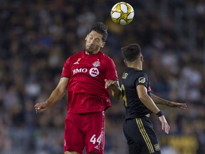 Toronto FC defender Omar González and Los Angeles FC forward Diego Rossi battle for the ball during their game last week. (USA TODAY SPORTS)