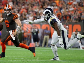 Cleveland Browns quarterback Baker Mayfield runs from a Rams defender last week. (GETTY IMAGES)