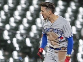 Toronto Blue Jays second baseman Cavan Biggio (8) reacts after hitting a two run triple during the ninth inning against the Baltimore Orioles at Oriole Park at Camden Yards. Mandatory Credit: Tommy Gilligan-USA TODAY