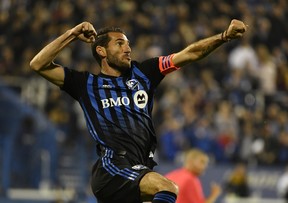 Montreal Impact midfielder Ignacio Piatti (10) reacts after scoring a goal against the Toronto FC during the first half in the Canadian Championship final at Stade Saputo in Montreal on Wednesday. 
Eric Bolte-USA TODAY Sports