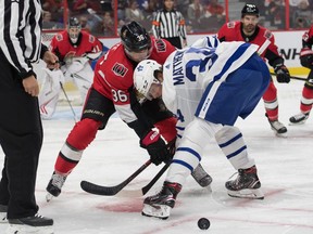 Maple Leafs centre Auston Matthews wins a draw against Colin White of the Senators during and exhibition game Sept. 18, 2019 in Ottawa. (Marc DesRosiers-USA TODAY Sports)