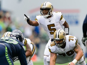 New Orleans Saints quarterback Teddy Bridgewater (5) points to the Seattle Seahawks defense during the second half at CenturyLink Field. (Steven Bisig-USA TODAY Sports ORG)