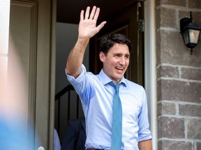 Justin Trudeau waves to supporters after speaking at an election campaign stop in Brampton Sept. 22, 2019.