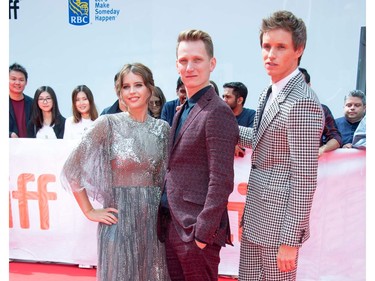(L-R) Actress Felicity Jones, director Tom Harper and actor Eddie Redmayne attend "The Aeronauts" premiere at the Roy Thompson Hall during the 2019 Toronto International Film Festival Day 4 on Sept. 8, 2019, in Toronto.
