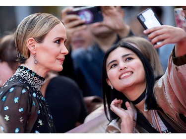 Sarah Paulson takes selfies with fans on her way to "The Goldfinch" premiere at the Roy Thompson Hall during the 2019 Toronto International Film Festival Day 4, Sept. 8, 2019, in Toronto.