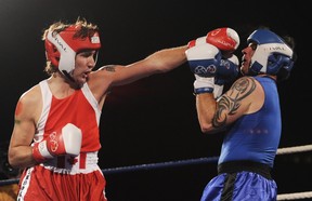 Then Liberal MP Justin Trudeau lands a punch on Conservative Sen. Patrick Brazeau during a charity boxing match at the Hampton Inn Hotel in Ottawa, March 31, 2012. Chris Roussakis/Postmedia