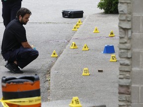 Peel Regional Police officers investigate a murder at Wally's Restaurant in Mississauga on Sept. 1, 2019. (Jack Boland, Toronto Sun)