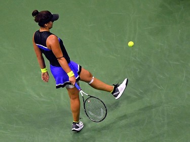 Bianca Andreescu of Canada kicks a ball after missing a point against Elise Mertens of Belgium during their women's Singles Quarterfinals match at the 2019 US Open at the USTA Billie Jean King National Tennis Center in New York on September 4, 2019. (Johannes Eisele/AFP/Getty Images)