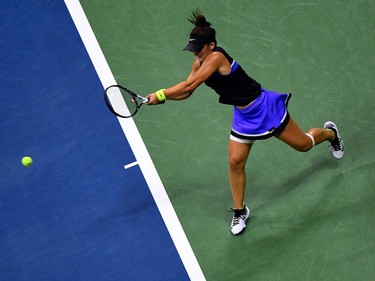 Bianca Andreescu of Canada hits a return against Elise Mertens of Belgium during their women's Singles Quarterfinals match at the 2019 US Open at the USTA Billie Jean King National Tennis Center in New York on September 4, 2019. (Johannes Eisele/AFP/Getty Images)