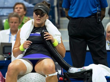 Bianca Andreescu of Canada cools off with a fan while playing Elise Mertens of Belgium during their Quarter-finals Women's Singles match at the 2019 US Open at the USTA Billie Jean King National Tennis Center in New York on September 4, 2019. (Don Emmert/AFP/Getty Images)