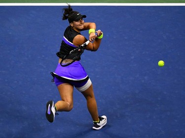 Bianca Andreescu of Canada hits a return against Elise Mertens of Belgium during their Women's Singles Quarterfinals match at the 2019 US Open at the USTA Billie Jean King National Tennis Center in New York on September 4, 2019. (Johannes Eisele/AFP/Getty Images)