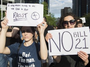 People attend a demonstration to protest against the Quebec government's Bill 21 in Montreal, June 17, 2019. (THE CANADIAN PRESS/Graham Hughes)