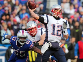 Jerry Hughes of the Buffalo Bills attempts to sack Tom Brady of the New England Patriots as he throws on December 3, 2017 at New Era Field in Orchard Park, N.Y. (Brett Carlsen/Getty Images)