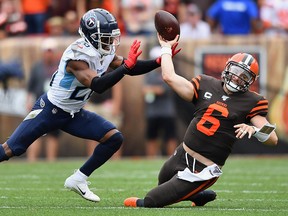 Quarterback Baker Mayfield of the Cleveland Browns is sacked by Logan Ryan of the Tennessee Titans at FirstEnergy Stadium on September 8, 2019 in Cleveland. (Jamie Sabau/Getty Images)